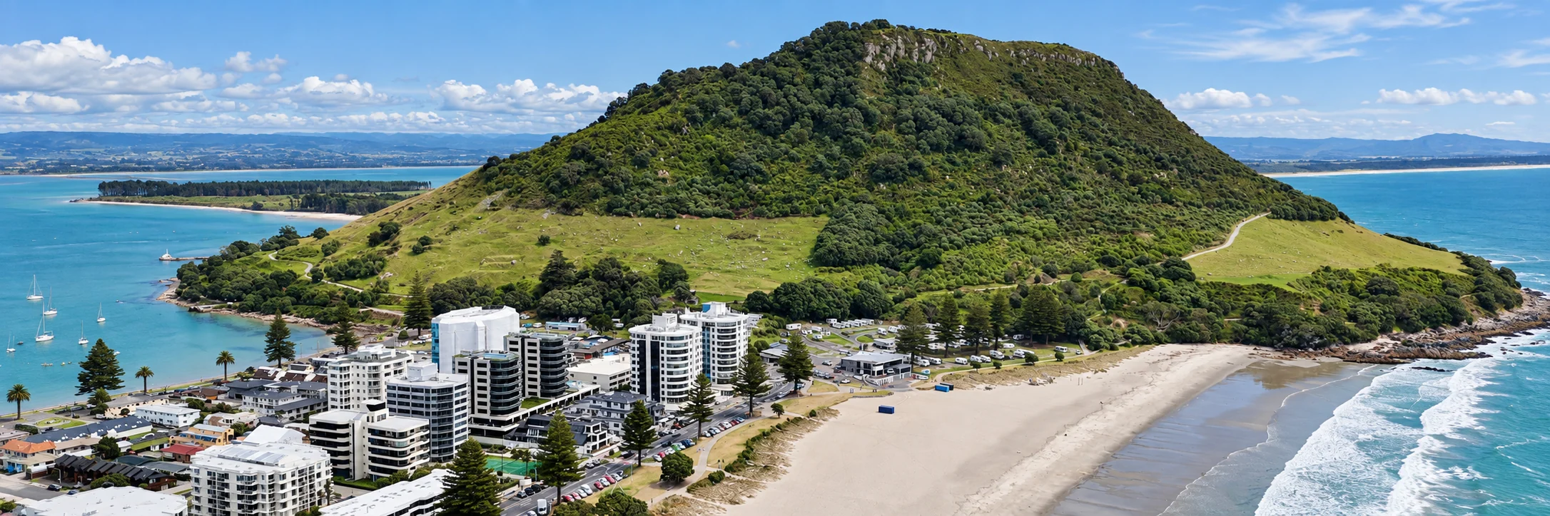 Mauao above the Mount peninsula, with Pilot Bay to the left and the ocean beach to the right