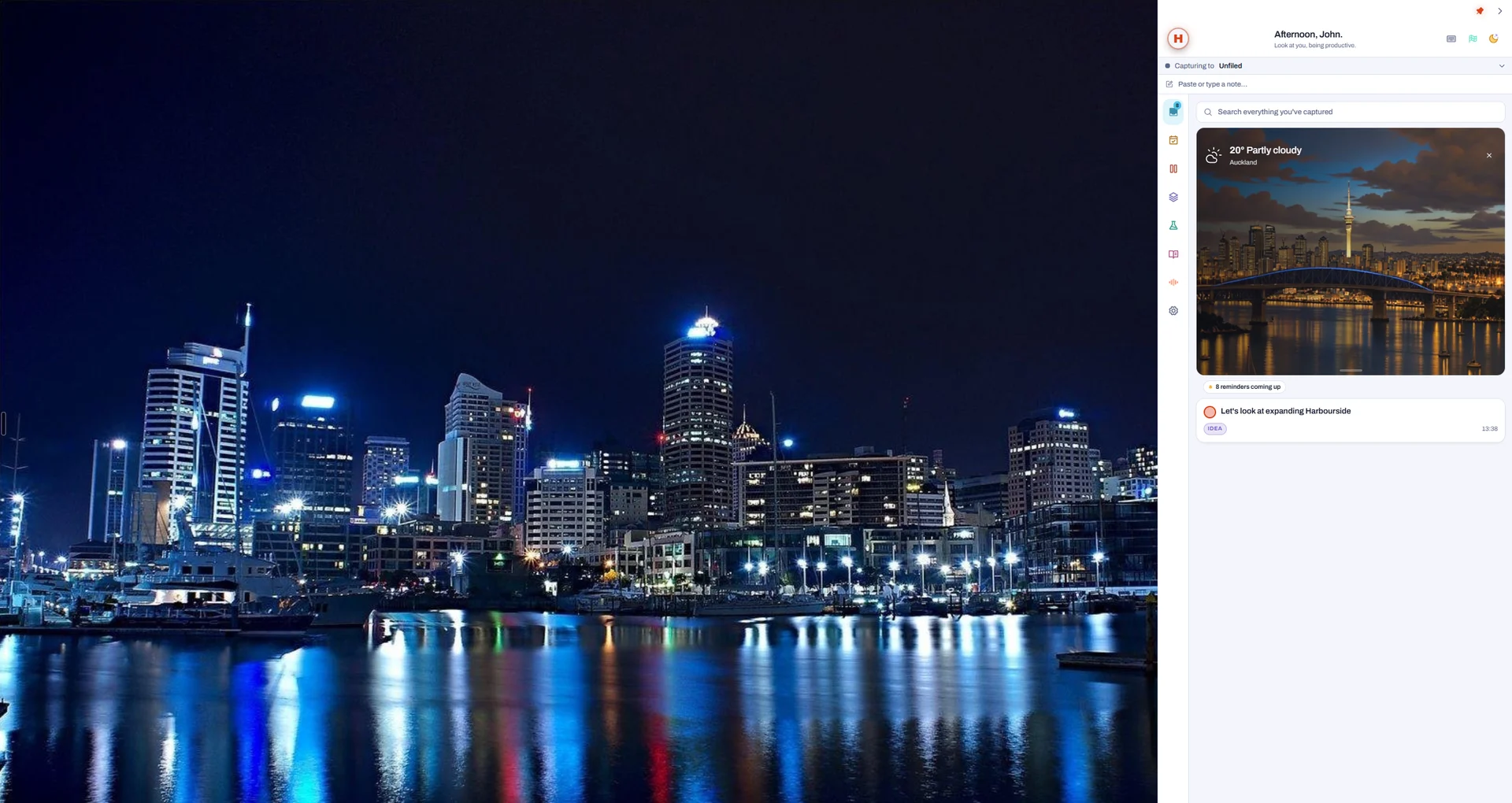 A Windows desktop over Auckland at night, with Hero docked on the right: the weather and a captured idea